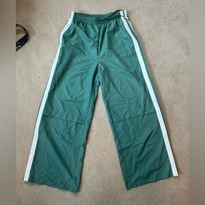 Green and white stripe track pants, size medium